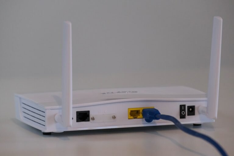 10Gtek Quad Port NIC Review: Unleash 2.5GbE Power white router on white table