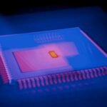 Blurred abstract image of a microchip with heatmap colors highlighting technological innovation.